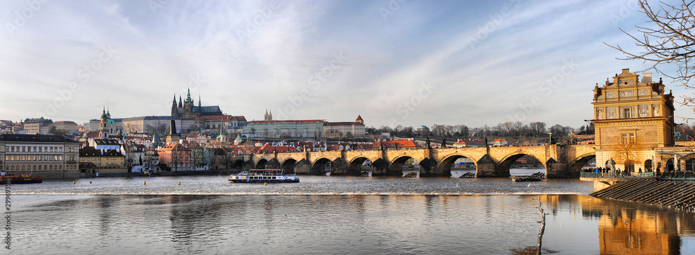 Charles Bridge in Prague, spring panorama on a sunny day, Czech Republic