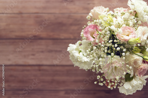 top view of beautiful romantic bouquet fresh spring flower on wooden table background with copy space © asiandelight