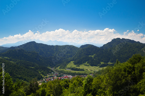 Resort Town Szczawnica in summer at Three Crowns Massif Background. Pieniny Mountains, Poland. View from Mountain Shelter Pod Beresnikiem.