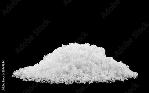 pile of fluffy white snow isolated on a black background. photo