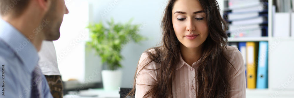 Portrait of beautiful worker listening and discussing statement with chief executive officer. Businesslady with brown long hair in pink blouse. Business concept. Blurred background Stock Photo | Adobe Stock Portrait of beautiful worker listening and discussing statement with chief executive officer. Businesslady with brown long hair in pink blouse. Business concept. Blurred background Stock Photo | Adobe Stock