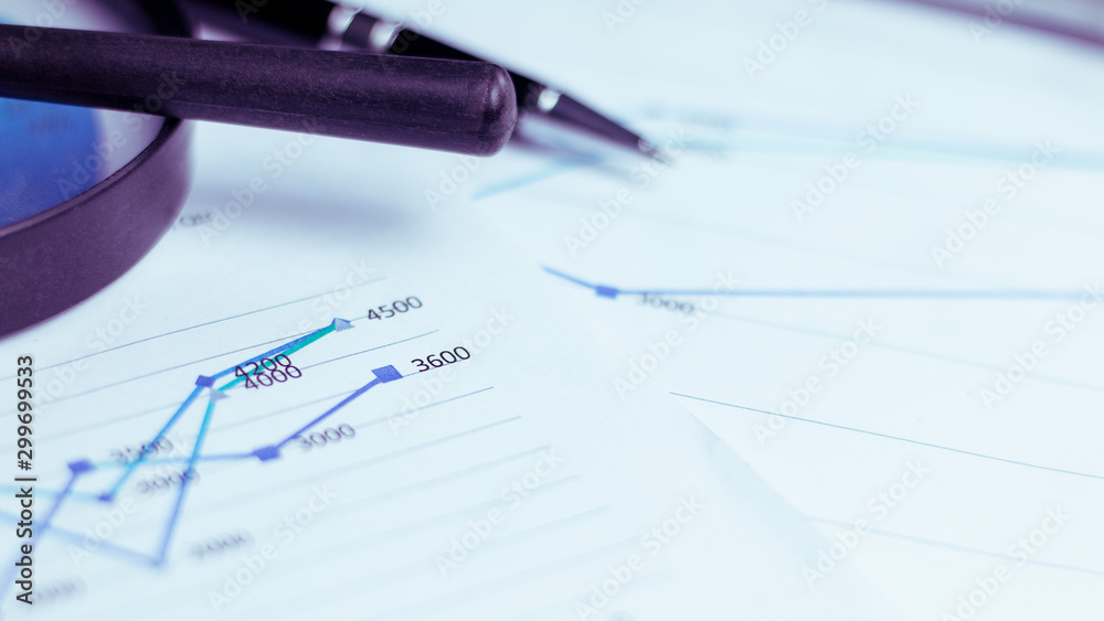 Charts and graphs are placed on the desks, data, and statistical performance of the company in the past year. Charts and graphs are placed on the desks, data, and statistical performance of the company in the past year.