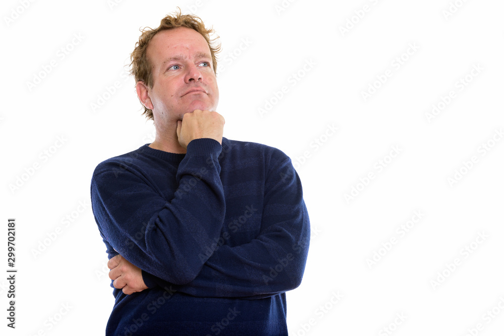 Studio shot of mature man with curly blond hair isolated against white background Studio shot of mature man with curly blond hair isolated against white background