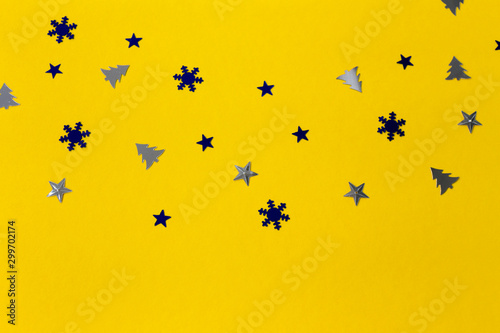 New Year and Christmas decorations on a yellow background, Flat lay.