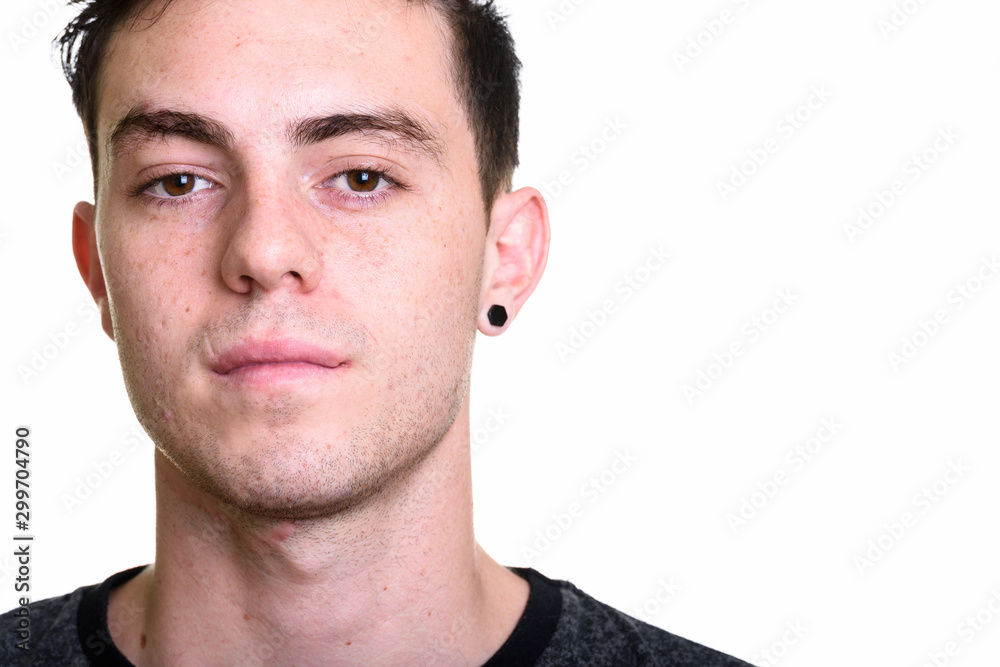 Fototapeta premium Studio shot of young handsome man isolated against white background