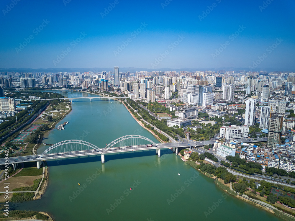 Fototapeta premium Aerial photos of high-rise residential area along the river and bridge across the river in the city
