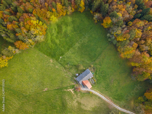 Aerial view of farm house and barn in rural area in Switzerland. Concept of organic agriculture.