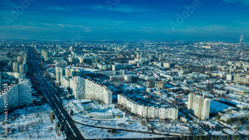 Top view of city in winter at sunset on sky background. Aerial drone photography concept. Kishinev, Republic of Moldova. photo