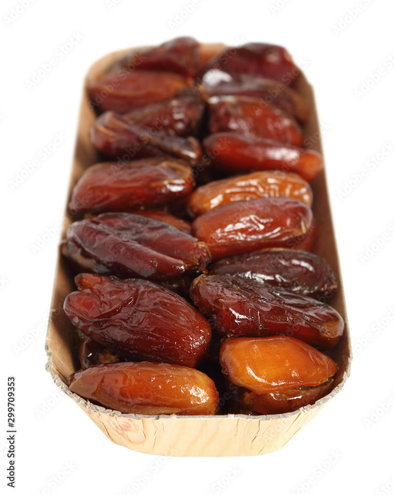 Dry dates in box. Isolated with clipping path. Macro. Dry dates in box. Isolated with clipping path. Macro.