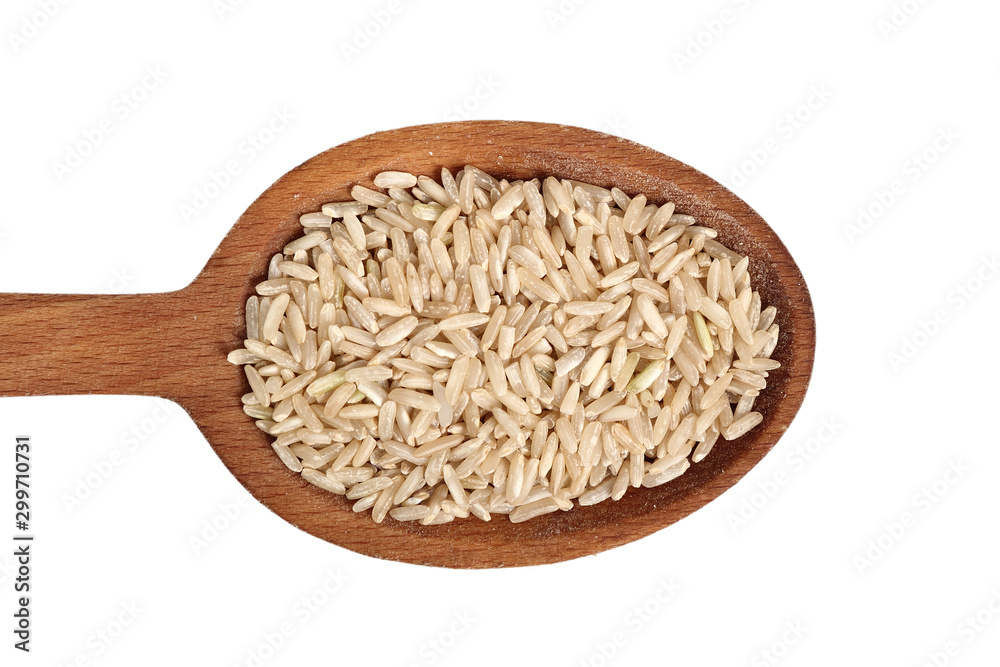 Long grain brown rice on wooden spoon. Isolated on white background. Directly Above. Long grain brown rice on wooden spoon. Isolated on white background. Directly Above.