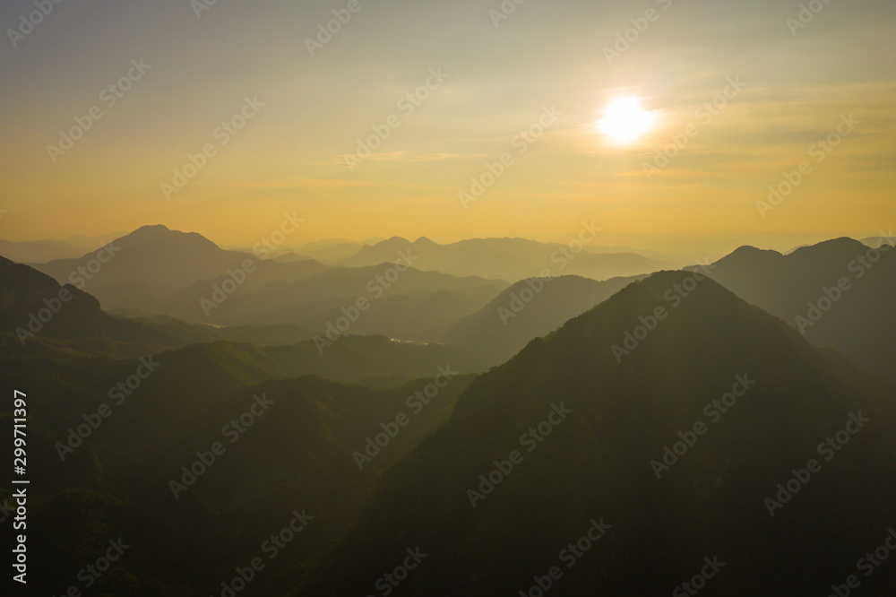 Aerial view of sunset in Nong Khiaw. North Laos. Southeast Asia. Photo made by drone from above. Bird eye view.