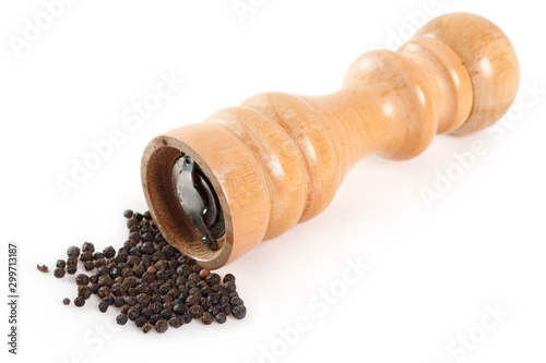 Wood Pepper Mill with black peppercorns. Isolated on white background.