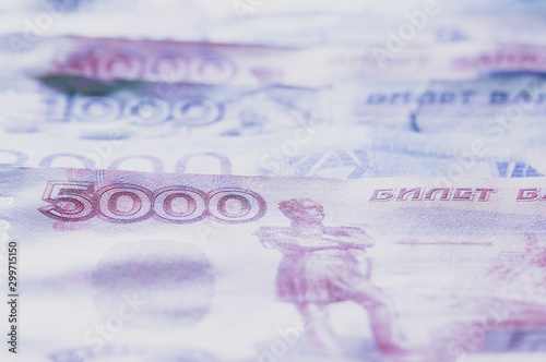 Russian money close - up at an angle, selective focus and toning of the image photo