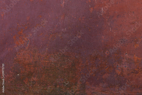 Fine texture of a rusty metal surface once painted red