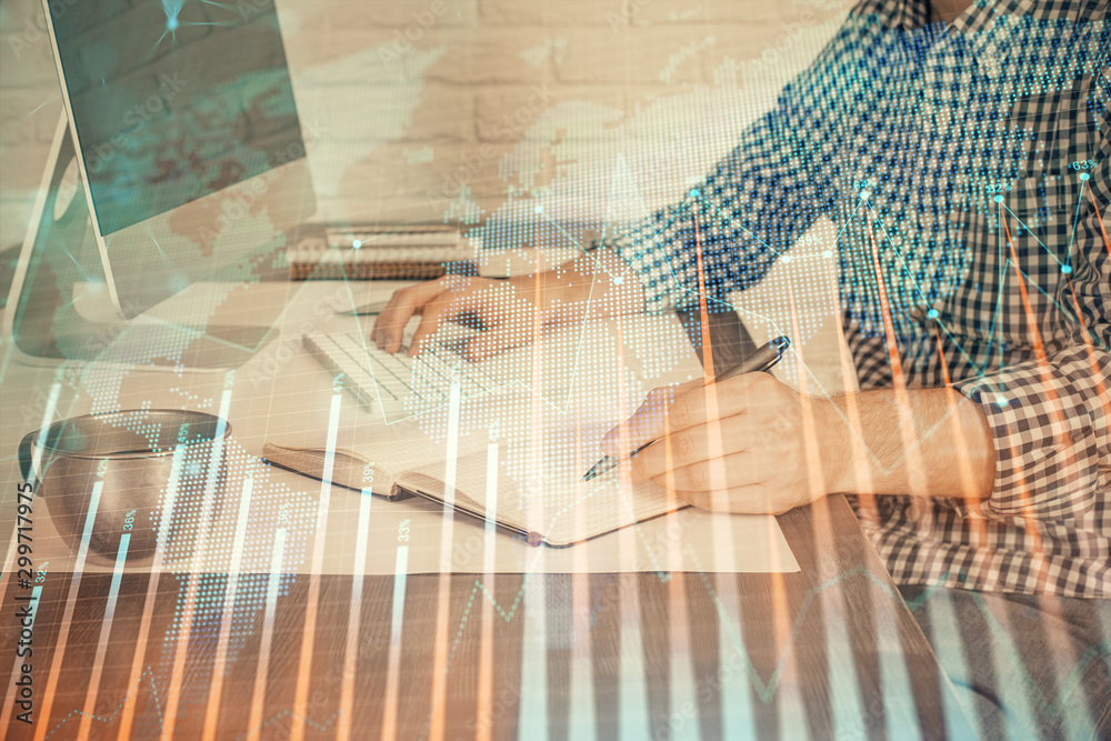 Double exposure of stock market chart with man working on computer on background. Concept of financial analysis. Double exposure of stock market chart with man working on computer on background. Concept of financial analysis.