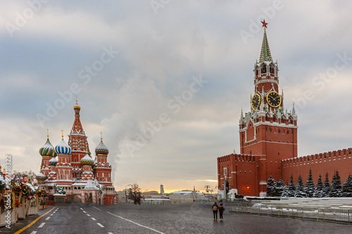 Saint Basil's Cathedral and Spasskaya tower in Red Square and colorful sky at winter morning.