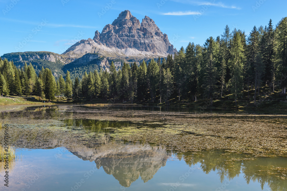 Tre Cime di Lavaredo, aka Drei Zinnen, reflection in water of Antorno Lake Dolomites, Italy. Tre Cime di Lavaredo, aka Drei Zinnen, reflection in water of Antorno Lake Dolomites, Italy.