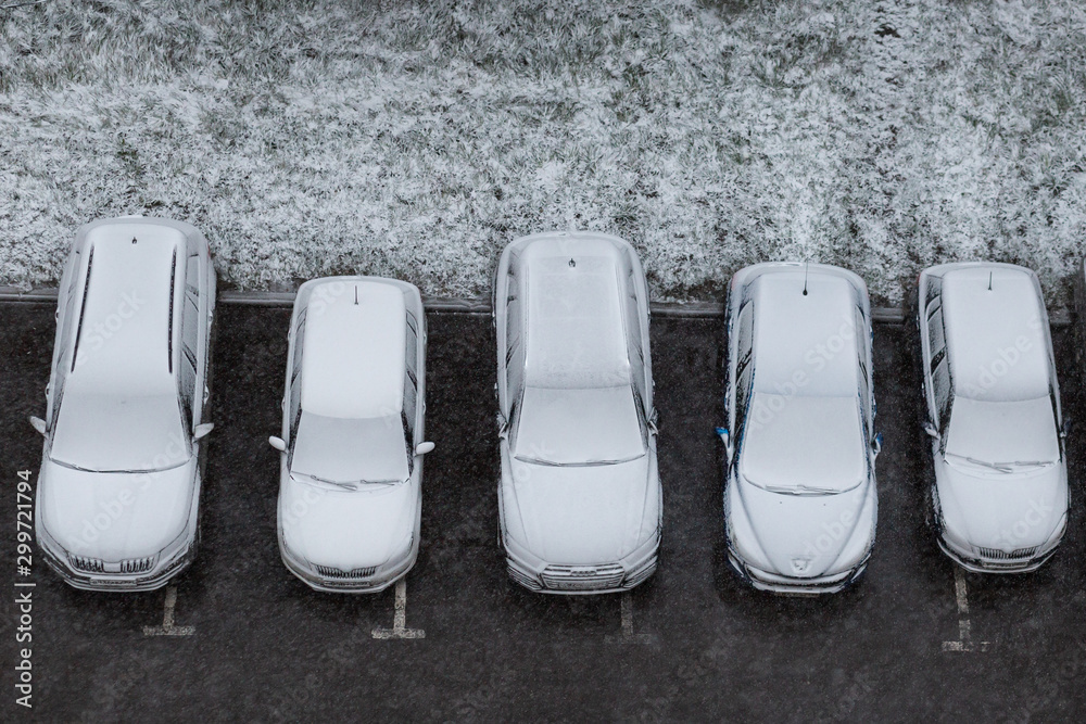 Cars under the snow. Cars covered snow after snowfall