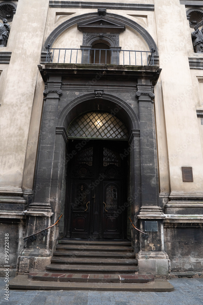 Closeup of Dominican Church in Lviv. Old building with staircase. Entrance Stairs The Door Old. Door to the Catholic Church. Stairs to the Church