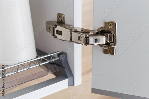 Door hinge of cabinet for drying dishes. photo