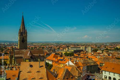 Aerial overview of Sibiu, Romania from the Council Tower with the Small Square Piata Mica and the ramp heading to the Lower town, while the Evanghelical Lutheran Cathedral dominates the skyline. photo