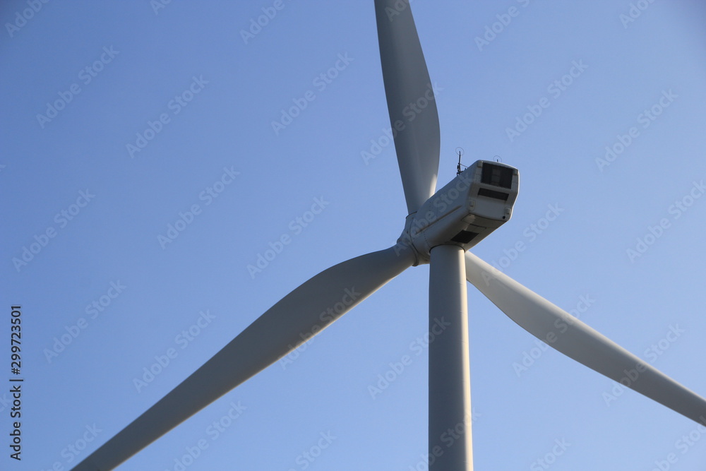 Wind turbine wings in close up in the dunes of Neeltje Jans island in the Netherlands. Wind turbine wings in close up in the dunes of Neeltje Jans island in the Netherlands.