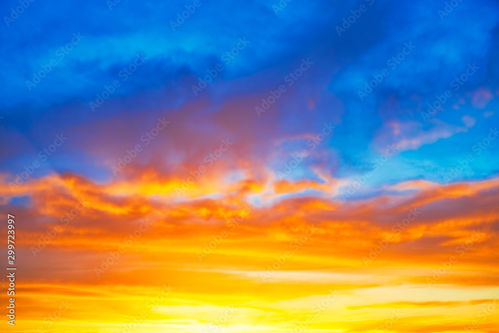 Sunset blue orange sky with sun and colorful clouds - obrazy, fototapety, plakaty 