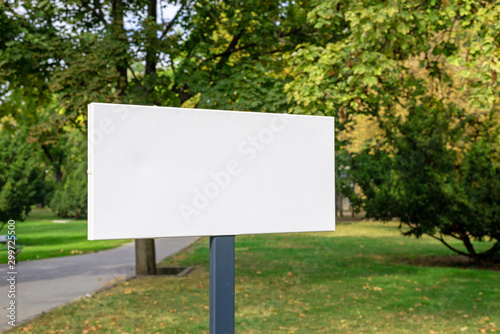 Blank sign in city park mockup.