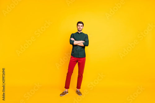 Full length body size photo of serious confident smart intelligent candid ceo standing pensively with hands folded thinking on taking you to job isolated over vivid color background