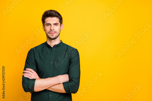 Portrait of gorgeous chic guy worker cross his hands feel serious ready solve start-up problems real expert wear casual style outfit isolated over yellow color background