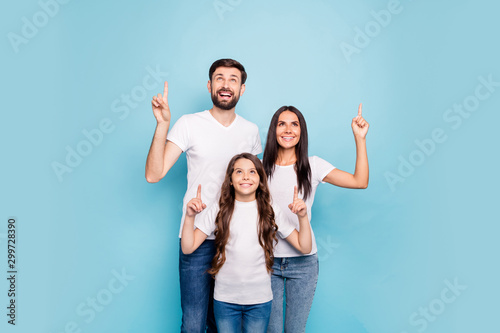 Portrait of three funky people promoters with brown hair show ads sales discounts recommend choice decision wear white t-shirt denim jeans isolated over blue color background