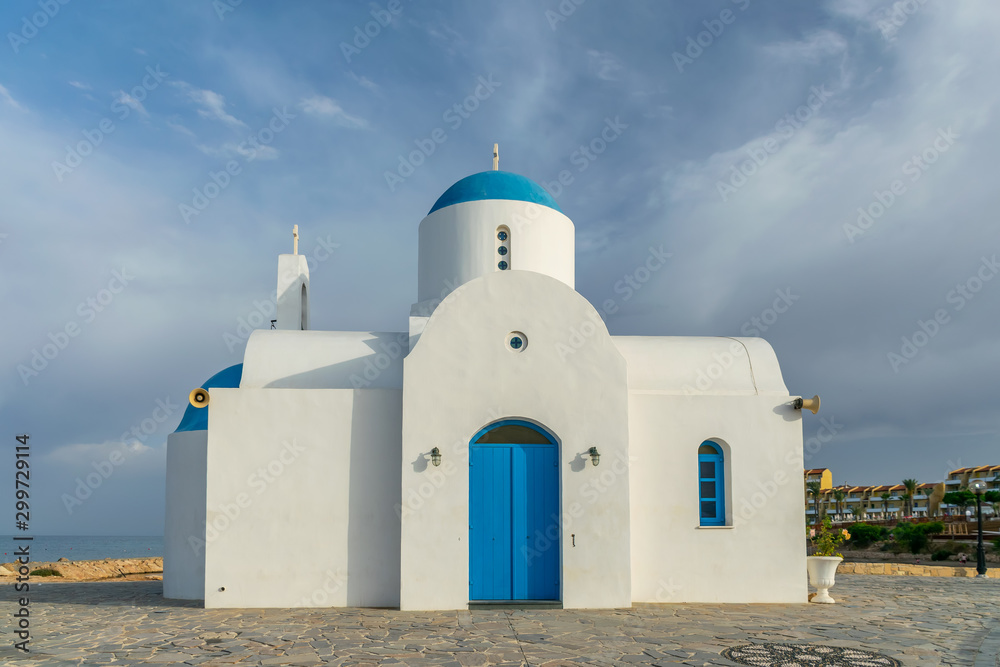 The picturesque Orthodox temple, built in the Greek style, is located on the coast of Cyprus.