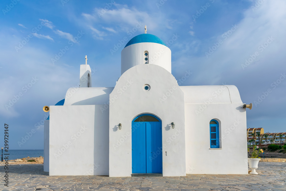 The picturesque Orthodox temple, built in the Greek style, is located on the coast of Cyprus.