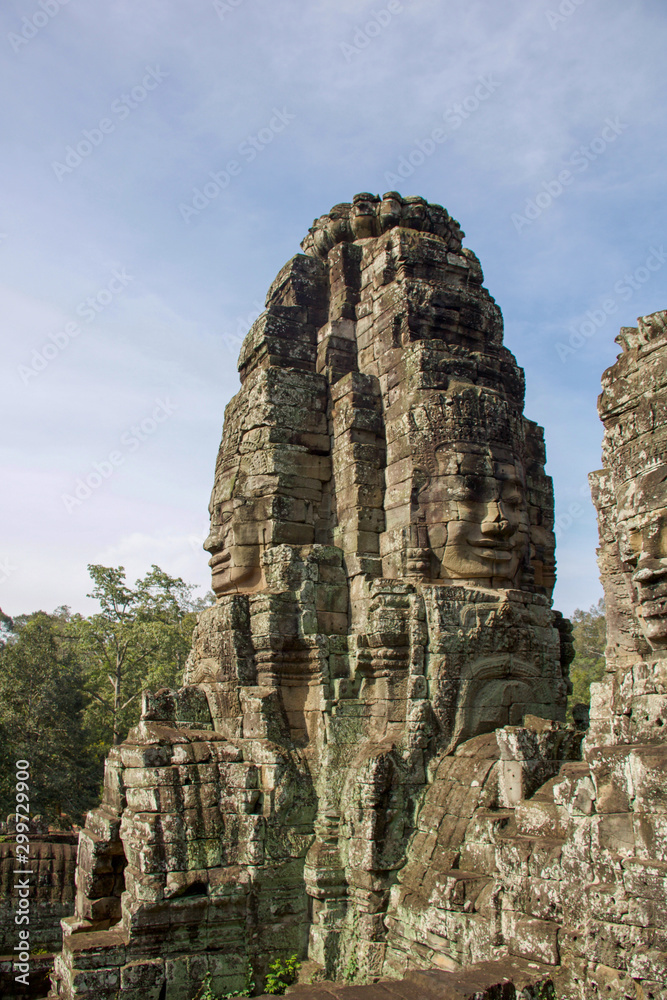 tower  with large buddha faces carved in angkor thom