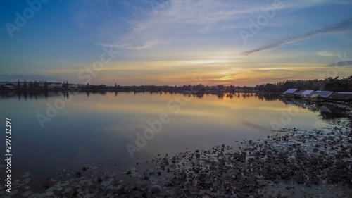 Aerial view evening above reservoir with red sun light and cloudy sky background  sunset at Krajub reservoir  Nong Kob  Ban Pong  Ratchaburi  Thailand.