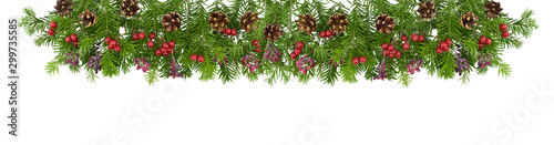A traditional Christmas garland. Sprigs of spruce decorated with berries of viburnum and barberry and cones. Isolated on white background. Border.