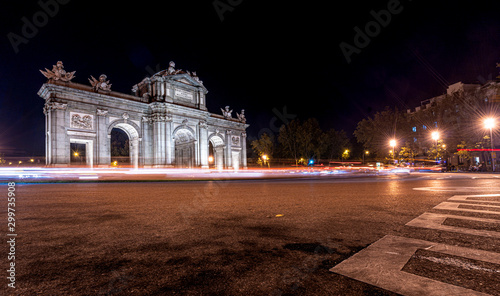 Night view of Puerta de Alcala with traffic lights in Madrid, Spain. Copy space available