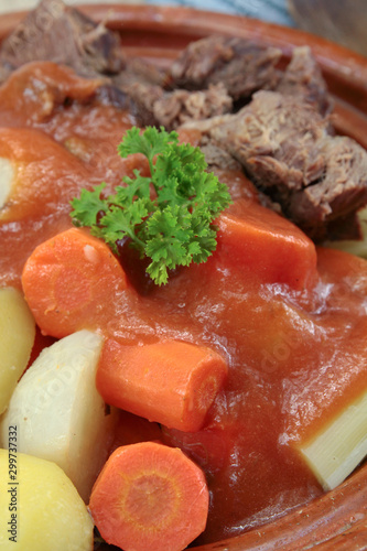 dish of pot au feu with beef on a table