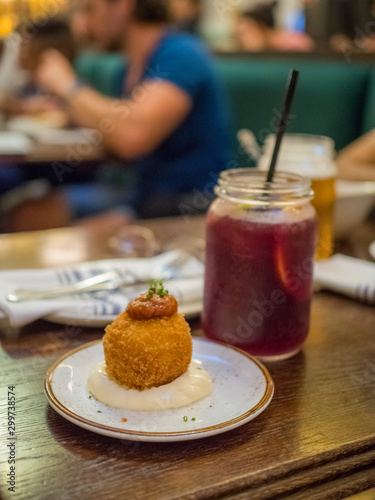 Tableau sur toile Spanish tapa called bomba served at a restaurant in Barcelona, Spain