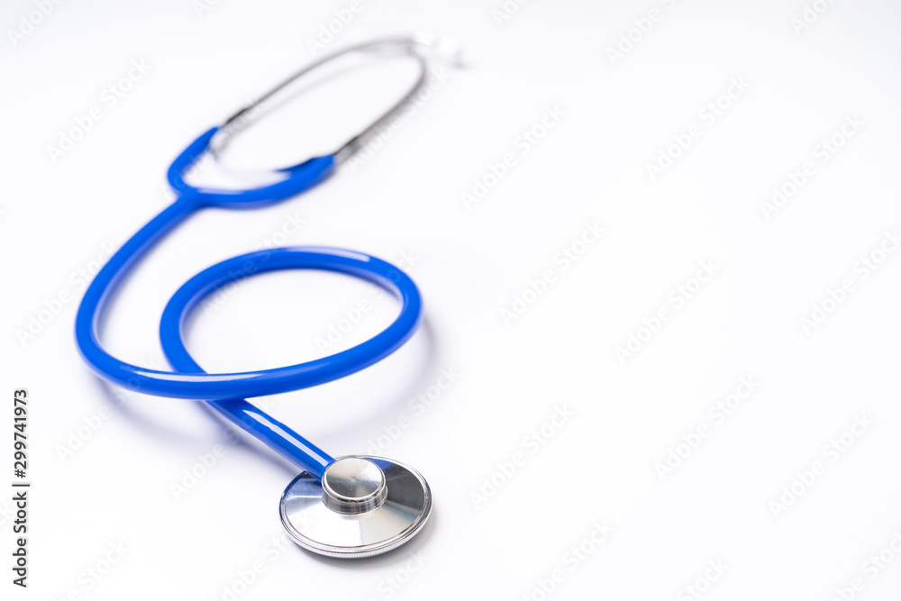 Blue stethoscope,object of doctor equipment for heartbeat trace,isolated on white background. Medical design concept,close up and studio shot. Blue stethoscope,object of doctor equipment for heartbeat trace,isolated on white background. Medical design concept,close up and studio shot.