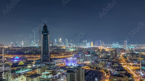 Wallpaper Mural Nighttime Aerial view of lights from new modern buildings at evening with downtown skyscrapers and traffic on roads Timelapse, Dubai, United Arab Emirates Torontodigital.ca