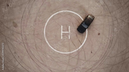 Ariel overhead shot drift sports car in a circle