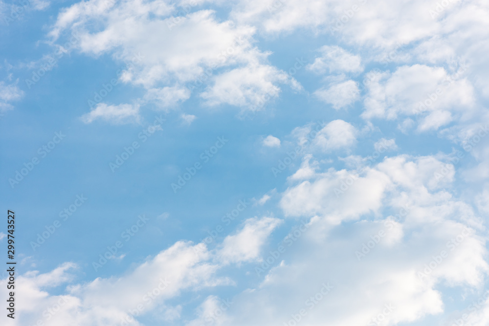 landscape sky with blue clouds and sunbeams at sunset. Background texture