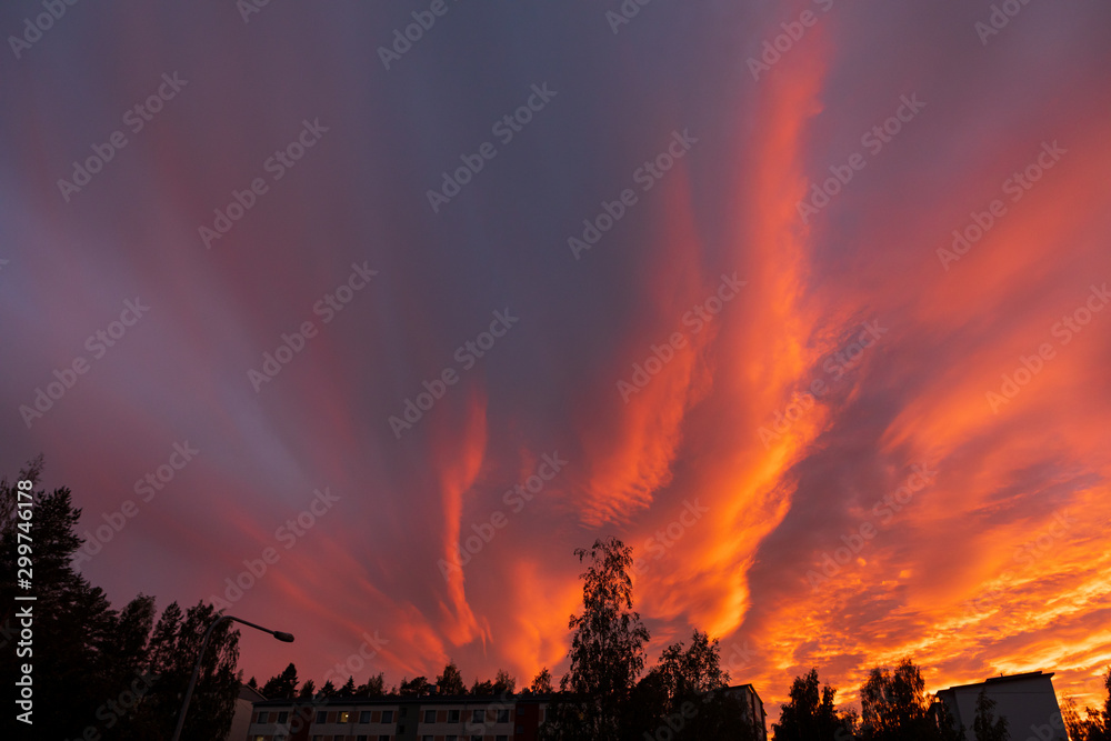 Dramatic fiery sky sunset cloudscape at dusk Dramatic fiery sky sunset cloudscape at dusk