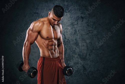 Handsome Athletic Muscular Men Exercising With Weights