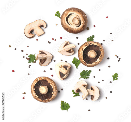 Fresh champignon mushrooms, herbs and spices on white background photo