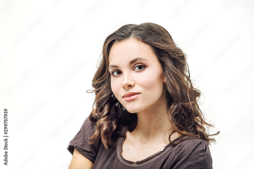 Young beautiful girl model with makeup and hairstyle beauty portrait in Studio on white background Young beautiful girl model with makeup and hairstyle beauty portrait in Studio on white background