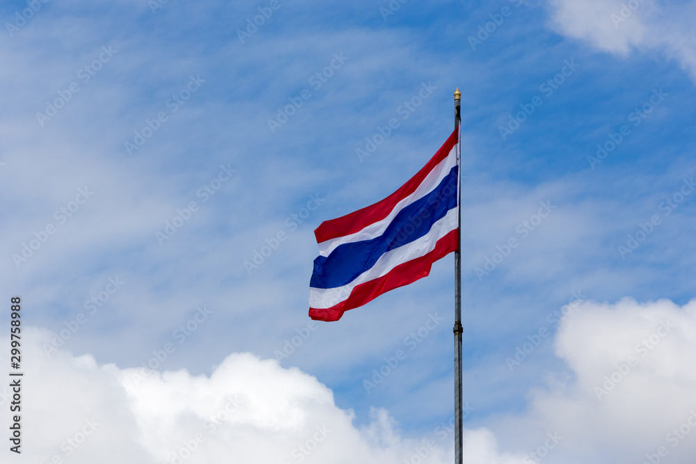 Image of waving Thai flag of Thailand with blue sky background. Image of waving Thai flag of Thailand with blue sky background.