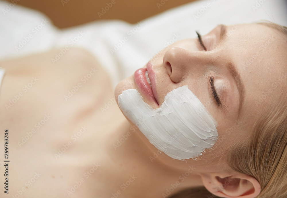 Beautiful young woman in cosmetic salon close up Beautiful young woman in cosmetic salon close up