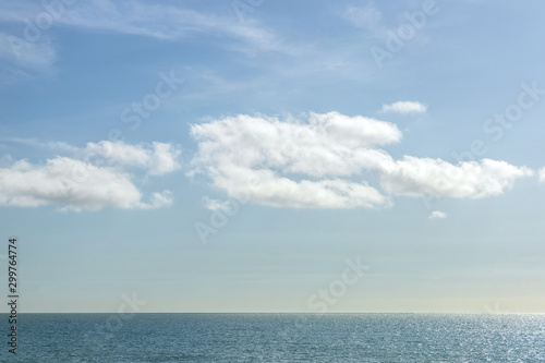 Blue sea and blue sky with white clouds, sunny day in United Kingdom